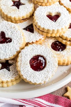 small cookies with jelly filling on a white plate