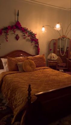 a bed room with a neatly made bed and flowers on the headboard