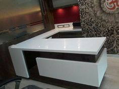 a white counter with black top in a room