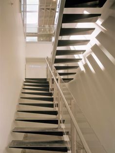 black and white stairs leading up to the second floor