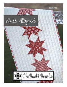 the star aligned quilt is hanging on a clothes line with text overlay that reads, stars aligned