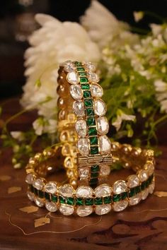 22k gold plated bangles with clear and emerald moissanite polki stone studded patterns. - Aza Fashions Jewellery Bangles, Green Moissanite, Ayushmann Khurrana, Diana Penty, Gold Plated Bangles, Luxury Sale, Kiara Advani, Stone Studs, Bangle Set