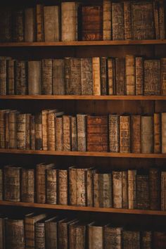 an old book shelf filled with lots of books