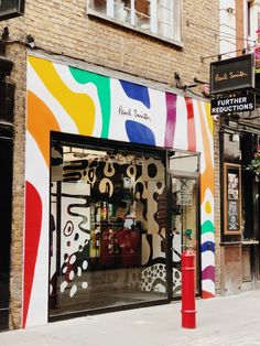 a colorful storefront on the side of a building