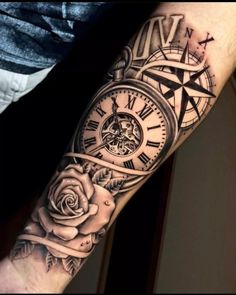 a man's arm with a clock and rose tattoo on it