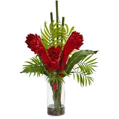 a vase filled with red flowers and greenery