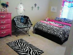 two zebra print beds in a girls'bedroom