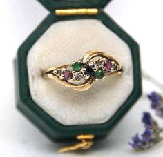 This is a stunning 9ct Gold, Diamond, Ruby, Emerald & Sapphire Ring. The ring has a beautiful twist design with four Diamonds, two Rubies, two Emeralds and a central Sapphire.  The stones sit on a strong gold twist mount.   The design is very unusual and quite beautiful.   The ring is stamped with a full set of English hallmarks (for 9ct Gold) and DIA (for Diamond) inside the band. Size: US 6 1/4 , UK M. Condition: Vintage wear & tear. This is a beautiful ring and would be a perfect gift for yourself or a Loved one. Diy Jewelry Rings, Vintage Wear, Rings Statement, Sapphire Ring, Gold Diamond, Ring Designs, Beautiful Rings, Ruby, Emerald