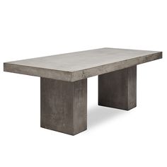 a concrete table sitting on top of a white floor