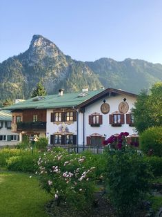 a white house with mountains in the background and text overlay that reads fairy tale towns in germany