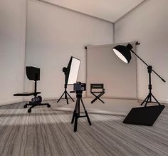 an empty room with several lighting equipment in it