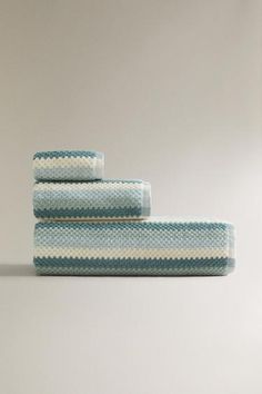 three folded towels on top of each other