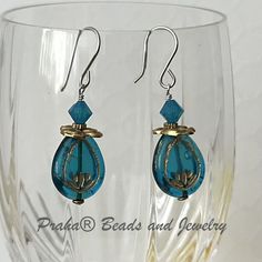 Awesome Czech glass earrings, made with sterling silver and brass. Bright blue (Caribbean blue) Czech glass beads are a teardrop shape. Gold etching on both sides of the bead. Bead size 17MM x 12MM. Blue Czech Glass Beaded Earrings, Blue Faceted Beads Earrings In Czech Glass, Blue Beaded Czech Glass Crystal Earrings, Polished Blue Czech Glass Beads, Blue Czech Glass Spiritual Beads