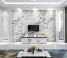 an elegant living room with marble walls and flooring is shown in this image, there are