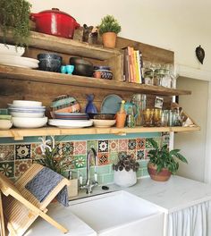 a kitchen counter with pots and pans on it