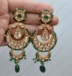 Premium quality Statement chandbali earrings beaded with crystal beads & tassels. Perfect for a sangeet or wedding wear. Earrings length: Approx. 3.5" Earrings weight: 18grms each earring Push-Back Closure. Antique Gold Plated on high-quality brass as the base metal In-stock & ready-to-ship Color may vary slightly due to light condition & photography. Jewelry Care: Keep away from moisture. Allow perfumes and lotion to dry before wearing. Store in jewelry pouch. Clean only with soft lint free clo Traditional Chandbali Beaded Earrings For Party, Celebration Chandbali Danglers With Dangling Beads, Kundan Chandbalis With Dangling Beads, Party Kundan Chandbalis With Dangling Beads, Luxury Green Chandbali Bridal Earrings, Traditional Chandbalis With Dangling Beads For Wedding, Kundan Chandbali Beaded Earrings For Celebration, Bollywood Style Chandbalis With Dangling Beads For Festive Occasions, Festive Chandbalis With Dangling Beads For Party