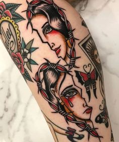 a woman's arm with tattoos on it