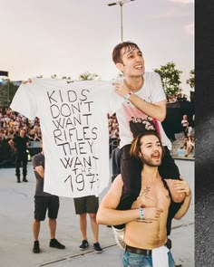 a man holding up a t - shirt that says kids don't want rules they want to do