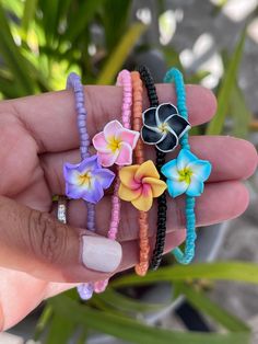 What is funner than jewelry around the ankles in the Summer???  This little anklet is composed of seed beads with a pretty resin plumeria.   It is very simple and pretty perfect for adding a little fun to any Summer outfit!   Tiny sterling lobster clasp and findings. Anklet measures approximately 10" MEASUREMENT OF ANKLE SUGGESTED TO ENSURE ACCURATE FIT.  View my other anklets here: https://www.etsy.com/shop/uniquebeadingbyme?ref=seller-platform-mcnav§ion_id=11690191 Flower Shaped Beaded Bracelets For Beach, Adjustable Flower Beaded Bracelets For Beach, Beach Flower Bracelets With Colorful Beads, Flower Shaped Colorful Beads Bracelets For Beach, Colorful Beaded Flower Bracelets For Beach, Flower Friendship Bracelets For Beach, Handmade Flower Beaded Bracelets For Beach, Flower-shaped Colorful Beads Bracelet For Beach, Handmade Flower Beaded Bracelets For Vacation