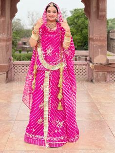 Zari Kasab Leheriya Humrahi Sawan Special Rajputi Poshak In Pink color Product Details: Fabric: Heavy Leheriya Humrahi  Work:  Zari Kasab  Odna me Four Side Border Odhna Fabric: Leheriya Humrahi  Color Family: Pink Style:Rajasthani, Rajputana Occasion:Festive, Traditional,Wedding Washing Instruction:Dry Wash The Semi-stitched Lehenga Waist and Hips are Customizable from 28 to 40 inches and from 32 to 44 inches respectively and Lehenga Length is 42 inches Do note: Accessories shown in the image a Lehariya Rajputi Poshak, Pink Dupatta Set For Puja, Pink Lehenga With Bandhani Print For Puja, Pink Bandhani Print Lehenga For Puja, Rajasthani Dress Traditional, Rajasthani Lehenga, Rajputi Poshak, Rajasthani Dress, Vs Image