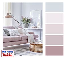 a living room filled with furniture and lots of pinks on the walls, along with a coffee table