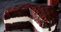 a chocolate cake with white frosting on a plate