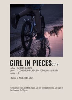 a person riding a bike down a street next to a puddle with the words girl in pieces on it