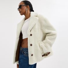 A perfect mix of cozy and chic this classic-fit coat is crafted of super soft shearling with smooth leather details. Featuring leather-covered buttons and adjustable waist buckles the warm topper is finished with slip pockets. | Coach Shearling Cardi Coat - Women's Size Medium - Cream Cream Coat, Fitted Coat, Loafer Sneakers, Shearling Coat, Coach Leather, New Tops, Covered Buttons, Black Coat, Wool Coat