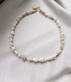 Shell beaded necklace Beaded Shell Bracelet, Seed Bead Shell Necklace, Beaded Necklace With Shell, Beaded Necklace Beach, White Pearl Beaded Necklaces For Vacation, Pearl Strand Beaded Necklaces For Beach, Handmade Pearl Beaded Necklaces For Beach, White Single Strand Necklace For Beach, Handmade Pearl Beaded Strand Necklaces