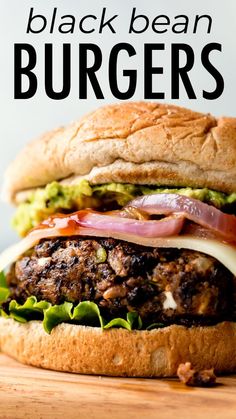 a close up of a burger on a wooden table with the words black bean burgers