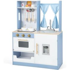 a blue and white wooden play kitchen set with sink, stove, oven and utensils