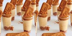 there are many desserts in glass cups with chocolate on top and peanut butter on the bottom