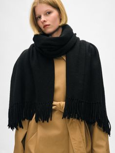 Our newest scarf is the perfect addition to your cold-weather wardrobe. Crafted from a cozy merino wool-cashmere blend, it boasts hand-twisted tassels at each end. The generous width allows you to wrap, knot and layer the accessory with ease. Details "70 1/2 X 27". 70% Wool, 30% Cashmere. Dry clean only. Style #21050 Tassel Scarf, White Shop, Cold Weather, Merino Wool, Tassels, Knot, Top Brands, Cashmere, Dry Clean