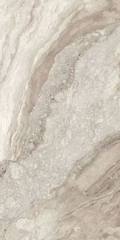 a white marble textured wall with grey veiners