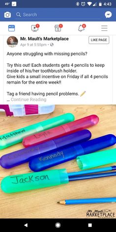 a group of pens sitting on top of a wooden table