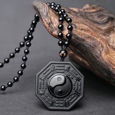 Metals Type: None Certificate Type: CMA Main Stone: Obsidian Fine or Fashion: Fine Shape\pattern: Cross is_customized: No Style: Classic Side Stone: None Pendants Type: Solitaire Item Type: Pendants Name:Obsidian Yin Yang Necklace Pendant Material:Natural Black Obsidian Pendant Size: 48*48*13mm (1mm=0.039in) Chain Length: adjustable Package: velvet bag Customized Black Round Jewelry, Personalized Black Spiritual Necklaces, Personalized Spiritual Black Necklaces, Symbolic Black Jewelry With 108 Beads, Jin Jang, Black Obsidian Necklace, Yin Yang Necklace, Element Necklace, Black Obsidian Stone