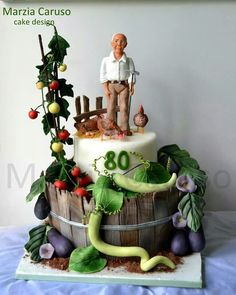 a cake decorated with an image of a man on top of a barrel and vegetables