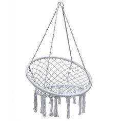 a white hanging chair with tassels