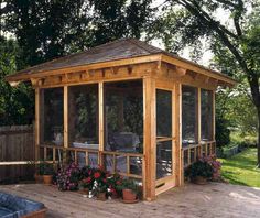 a gazebo sitting on top of a wooden deck