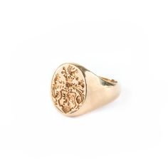 A stunning and unusual gold signet ring made of 14K yellow gold, this ring has a large oval-shaped face with a deeply carved intaglio center. There is very little wear and all of the design is very clear. Shank is original to the ring and is tapered from design top to bottom. 14K yellow gold Tiffany & Co. MarkingHallmarks Tiffany & Co. and 14KEngraved in the back of the bezel “June 8, 1979 to 1989”Measurements/WeightSize: 8T.W.: 6.1 DWT (9.5 grams)WearExcellent. Besides normal surface we Gold Tiffany, Designer Rings, Gold Signet Ring, Gold Set, Earrings Rings, Signet Ring, Store Design, Tiffany & Co., Luxury Designer