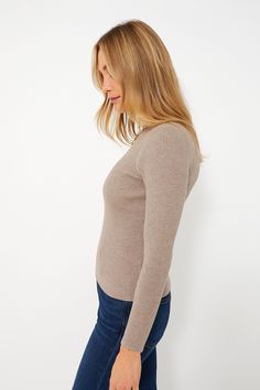 A do-it-all silhouette, the Oat Alden Ribbed Crewneck plays just as well as a top as it does a base layer on chilly days. Skimming the body enough to style under a sweater or a blazer, or tuck into a silk skirt or denim, this heathered classic will quickly become a hero style in your closet. Crew neckline Raw hemline Ribbed fabric Heathered coloring Material: 40% Viscose, 20% Nylon, 20% Polyester, 20% Spandex Care: Hand wash cold, hang to dry Snug Soft Knit Turtleneck Top, Beige Ribbed Stretch Sweater, Beige Stretch Ribbed Sweater, High Stretch Fine Knit Winter Tops, Snug Fit Long Sleeve Ribbed Tops, Snug Fit Ribbed Long Sleeve Tops, Versatile Ribbed Knit Top For Winter, Versatile Ribbed Top For Winter, Snug Ribbed Tops For Fall