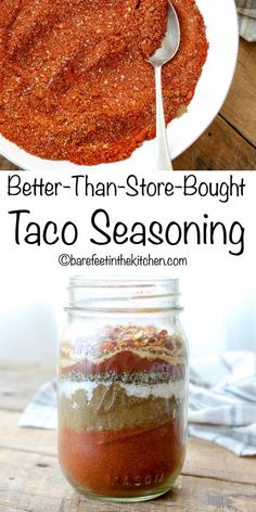 a jar filled with taco seasoning on top of a wooden table next to a spoon