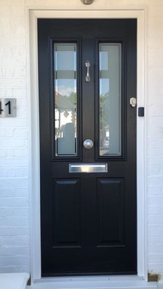 a black front door with two glass panels