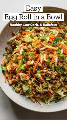 an egg roll in a bowl with lettuce and carrots