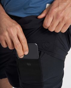 Unlock more momentum with this upgraded version of our classic Kore Short—featuring new zip pockets that keep your essentials safe and secure, plus a new performance fabric with black trims. Go commando in confidence with the breathable, boxer-brief liner. | Vuori Elevate Kore Shorts | Black | XS Vuori makes premium performance apparel inspired by the active Coastal California lifestyle; an integration of fitness, surf, sport, and art. Breaking down the boundaries of traditional activewear, we a Coastal California, Black Athletic Shorts, California Lifestyle, Black Xs, Performance Outfit, Performance Fabric, Fabric Shop, Shorts Black, Black Trim