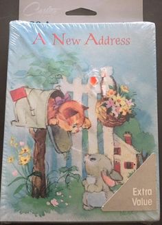 a new address card with an elephant and bunny in the mailbox next to flowers