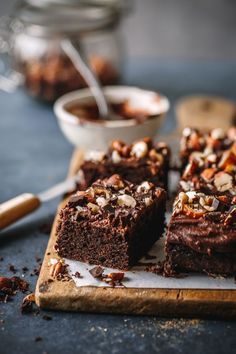 chocolate brownies with nuts on a cutting board