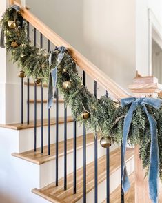 christmas garland on the banisters with bells and ornaments