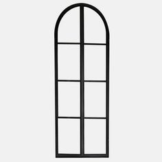 an arched window with black metal frame and glass panels on the bottom, against a white background