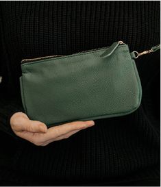 Take the Kira Mini Clutch on the go and let it hold your keys, phone, and cash in style like any minimalist's sure to love.This small clutch comes in a ton of great colors and is easy to carry thanks to its wristlet strap.Wrap it around your wrist or use it as a bag organizer. Either way, you're going to love this vegan leather clutch.Dimensions: 8.5" wide x 5" long Boutique Decor, Small Clutch, Ring Pendant Necklace, Leather Tassel, Modern Chic, Cotton Velvet, Bag Organization, Red Plaid, Bag Tags